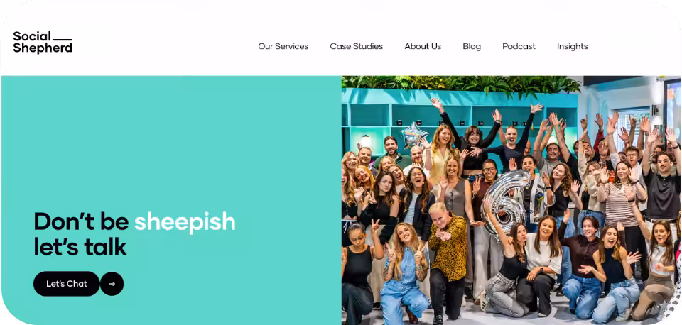 Social Shepherd Agency website homepage showcasing a bright group photo of their employees with the tagline ‘Don’t be sheepish. Let’s talk!’ against a teal background.