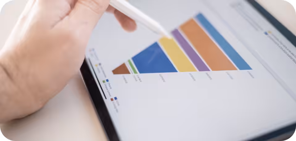 Close-up of a hand using a stylus on a tablet screen displaying a colourful funnel chart, representing data visualisation, sales analysis, and digital marketing insights.