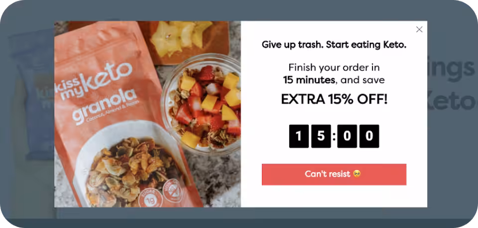 Limited-time offer pop-up on a keto food website, featuring a 15-minute countdown timer and an extra 15% discount on Kiss My Keto granola purchase. Example of bottom-funnel marketing to drive conversions.