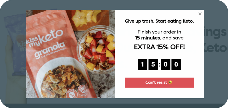 Limited-time offer pop-up on a keto food website, featuring a 15-minute countdown timer and an extra 15% discount on Kiss My Keto granola purchase. Example of bottom-funnel marketing to drive conversions.